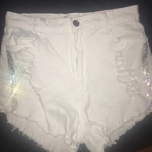 White jean shorts with rhinestones on the side